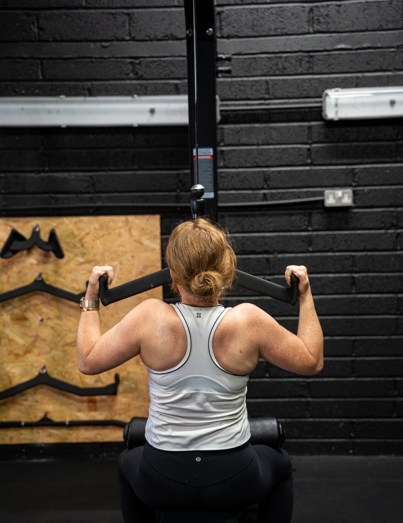 Client performing a lat pulldown exercise