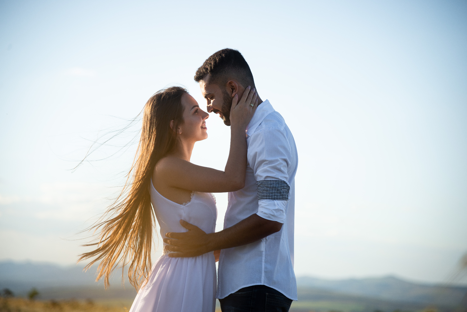 Couple embracing at golden hour