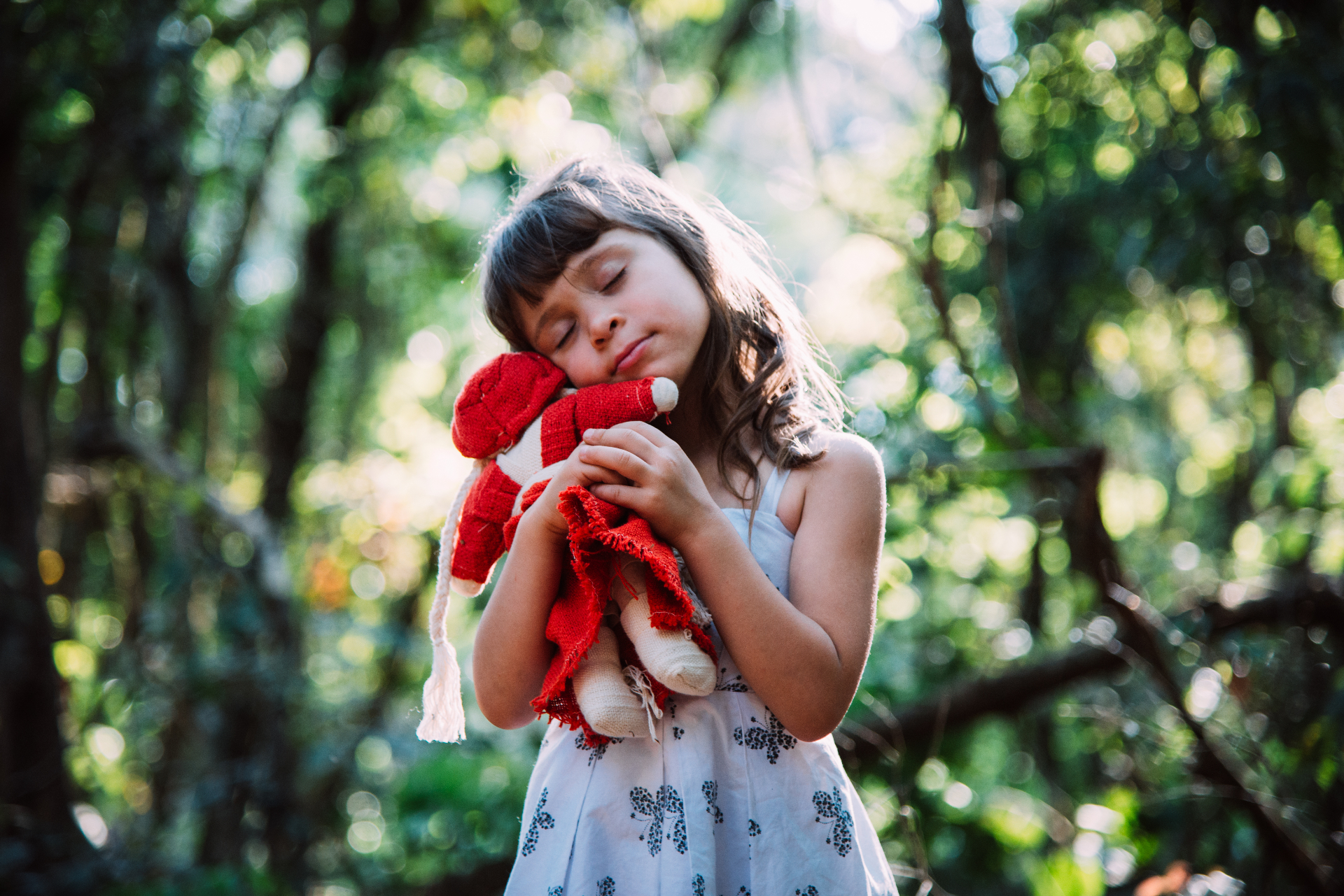 Peaceful moment of a girl embracing her doll